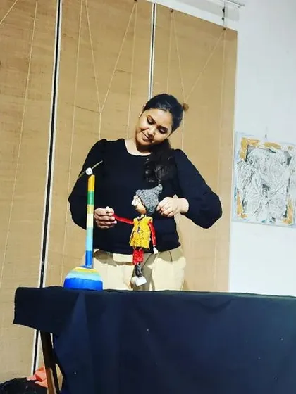 Our puppeteer demonstrating how to use a simple hand puppet during a workshop.