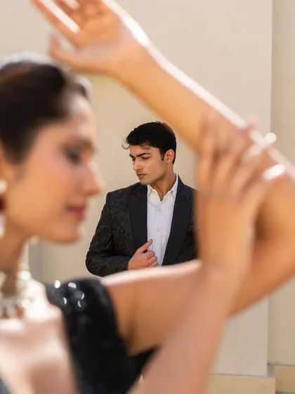 We have fun outfits for the boy and bae. This shot gives a glimpse of a black sequin lehenga paired with a sharp men's tuxedo, perfect for a cocktail night.