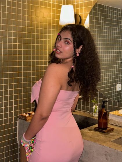 The back of the pink dress. It’s simple, chic, and lets the color do all the talking.