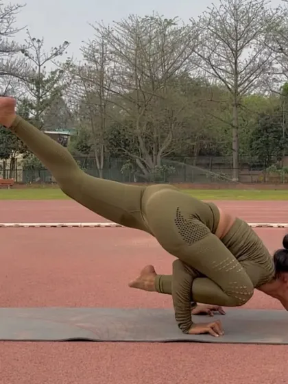 Eka Pada Koundinyasana II is a challenging arm balance that involves a twist. It builds incredible upper body and core strength while also stretching the hamstrings.