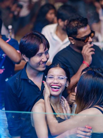 Friends sharing a happy moment on the dance floor.