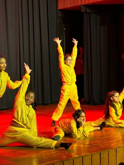 This is a snapshot of pure joy and technical skill from our Recital 2024. Our advanced kids' batch showcases their flexibility and stage presence in their vibrant yellow costumes, owning the stage with confidence.