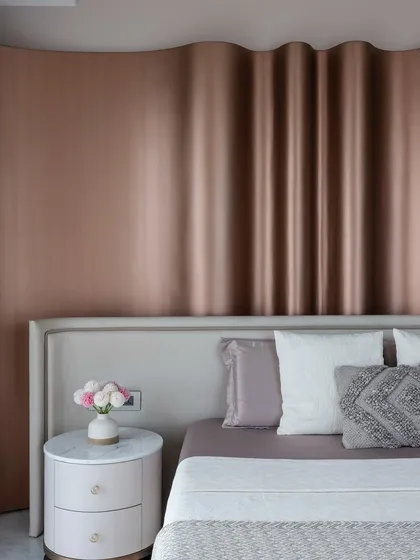 Another angle of the unique headboard in 'The House of Arcs', showcasing its sculptural quality.