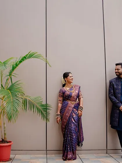 A modern, minimalist portrait of the couple. The clean background and simple composition put all the focus on their happy interaction.