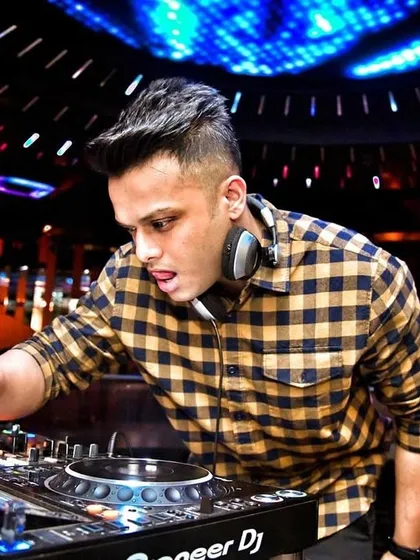 A classic shot of me working the Pioneer DJ setup. This highlights the professional equipment I use to deliver a high-quality audio experience for every gig.