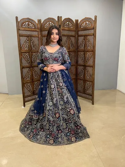 This navy blue lehenga is a perfect example of modern design meeting traditional craftsmanship.
