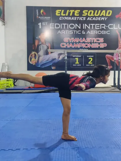 Another student perfecting her arabesque. We work on these foundational balance movements to ensure our gymnasts have a strong and stable base.