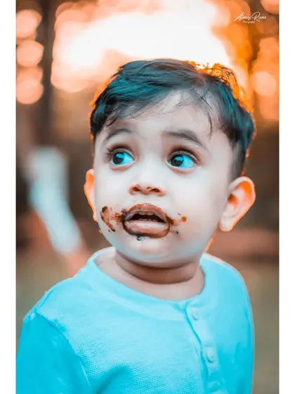 The aftermath of a chocolate cake smash. This close-up of Ivaan captures the innocent, messy fun of being a kid. My goal is to freeze these fleeting, authentic expressions that tell a story.