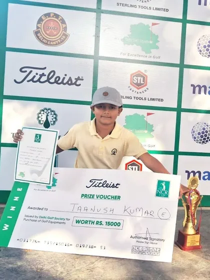 Taanush Kumar with his winner's trophy and prize voucher from the NCR Cup 18th Junior & Amateur Golf Tournament.