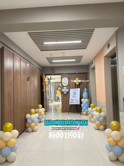 A warm welcome starts at the door. I decorated this entire corridor for a "Welcome Home Baby" event, with balloon clusters leading the way from the elevator to the main entrance, creating a path of celebration for the new arrival.