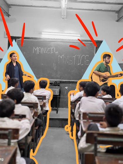 Two instructors, one with a guitar, lead a classroom session together. This co-facilitation model brings diverse energy and skills, making the learning experience even richer for the students.