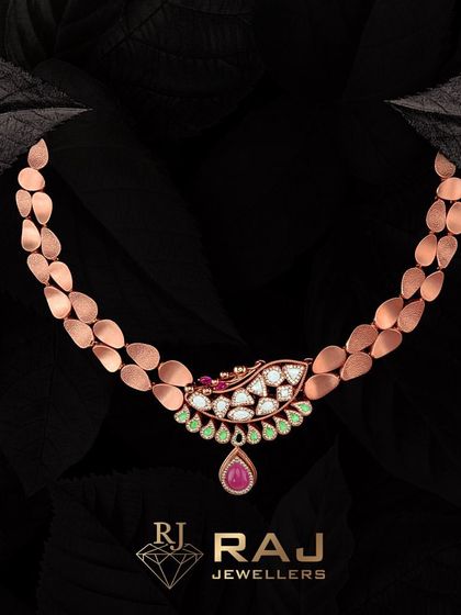 This Revaj necklace is thoughtfully created to reflect unique personality and style. The rose gold chain is adorned with a delicate pendant featuring polki, rubies, and emeralds, making it a statement of individuality.