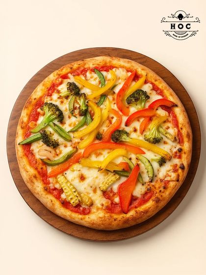 Our wood-fired pizzas are a crowd favourite. This vegetarian pizza features a crisp crust, rich tomato sauce, and a generous topping of fresh vegetables like broccoli, colourful bell peppers, and baby corn, all melted together with mozzarella cheese.