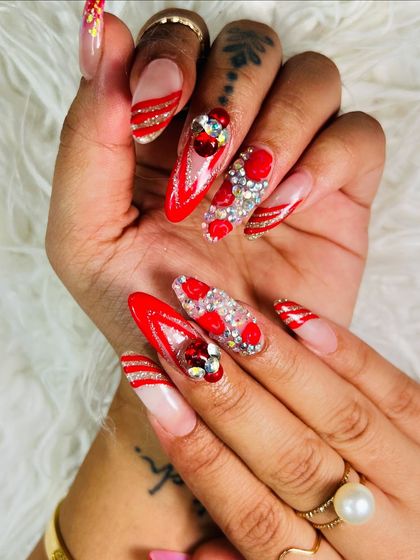 A full view of this festive red nail art set, complete with intricate silver glitter stripes and 3D heart and jewel clusters.