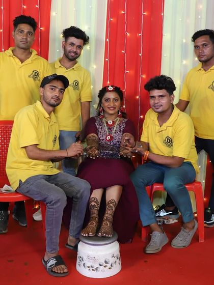 My team with a bride, ready for her wedding with full hands and feet mehndi.