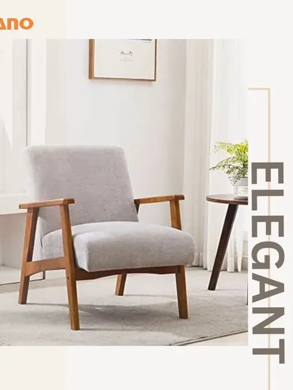 An elegant armchair with a wooden frame and light grey upholstery. This design is a great example of our mid-century modern inspired pieces.