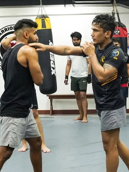 A coach demonstrates the proper way to check a kick. Defense is just as important as offense, and we teach a complete striking system.