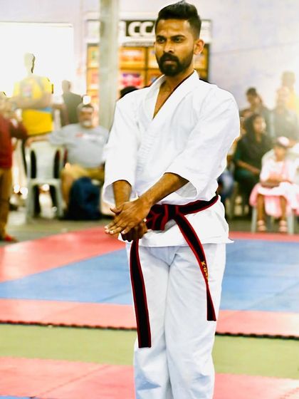 The moment of calm before the storm. Centering myself before beginning my kata performance at the national level.