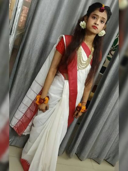 This full-length view shows the complete Saraswati Puja look. Our students learn not just makeup, but also how to style a look in harmony with the outfit and occasion.