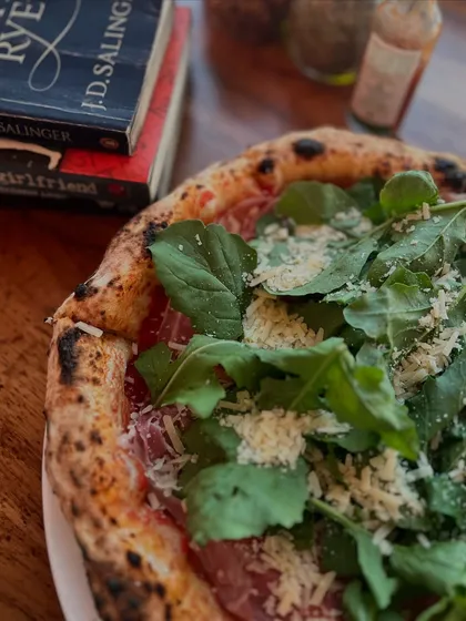 A classic combination: our Parma Ham & Arugula pizza paired with some classic literature.