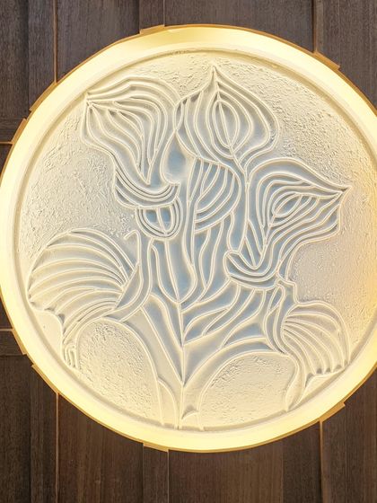 We take pride in adding handcrafted touches to our projects. This backlit wall art, made from MDF and putty, is an example of how we turn a simple white wall into a piece of art, adding texture and soft ambient light.