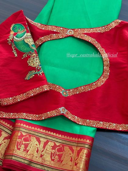 Another view of the red blouse with the painted parrot.