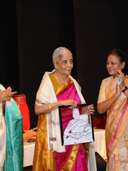 What a precious moment. Here is the incredible Smt. Alamelu, mother of Hariharan sir, holding the custom paper-cut portrait I made for her. I'm so grateful for these opportunities to create meaningful gifts.