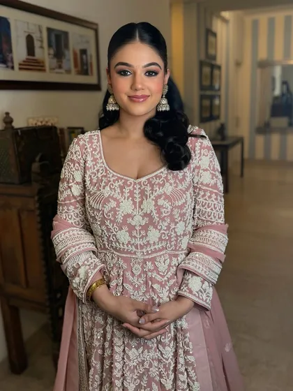 The final look for this pre-wedding event. The client looks happy and confident, proving that understanding and delivering on a client's vision is key.