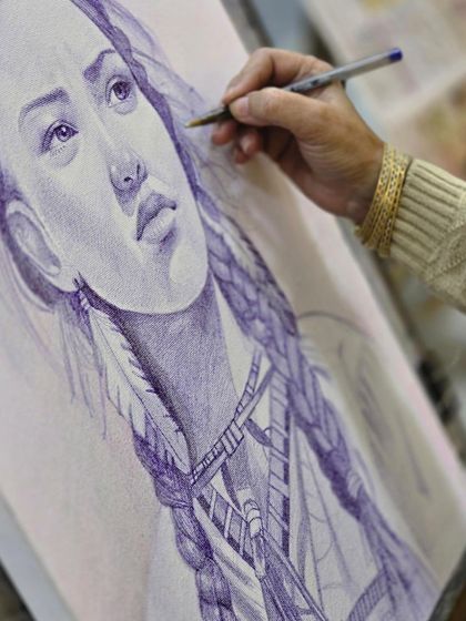 This shot captures the fine detail work around the eye and feathers of the ballpoint pen portrait.