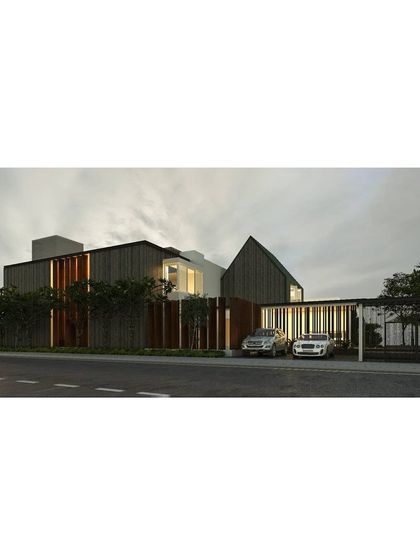 The street view of our proposed CLT and Glulam residence in Tamil Nadu. The design breaks up the long facade with varied forms and materials, creating a dynamic and modern elevation.