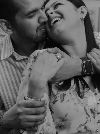 A black and white close-up filled with laughter and love. By stripping away the color, we focus entirely on the emotion of the moment: the crinkle of their eyes, the wide smiles, and the warmth of the embrace.