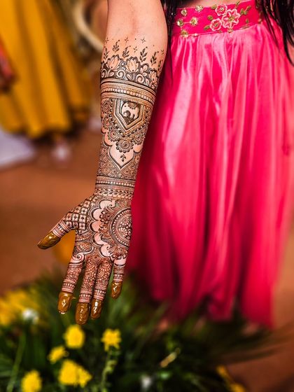 A beautiful bridal design featuring a portrait of a bride in a doli, or palanquin, a classic wedding motif.