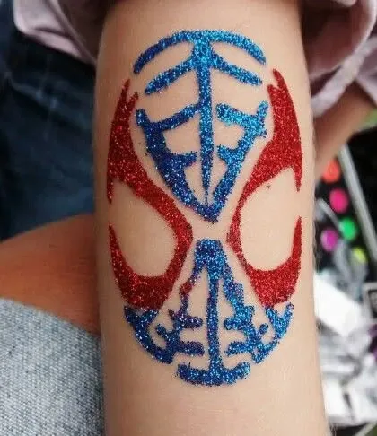 A bold, tribal-style mask in red and blue glitter. This kind of design is great for superhero or action-themed parties and is popular with kids who want something cool and powerful.