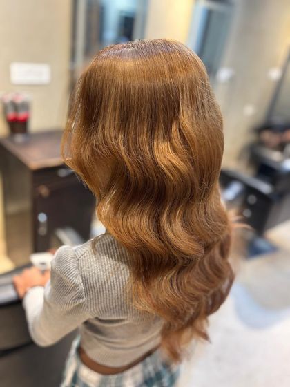 This image captures the beautiful waves and rich color of our ash blonde service.