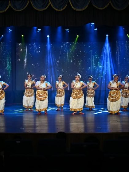 A wide-angle shot of our Mohiniyattam performance, capturing the full scale of the group and the professional stage production at "NATYAMANIA SEASON 2".