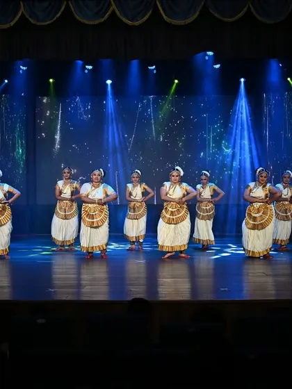 A wide-angle shot of our Mohiniyattam performance, capturing the full scale of the group and the professional stage production at "NATYAMANIA SEASON 2".