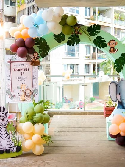 The entrance to the "Wild One" safari party, with a welcome sign and adorable zebra and elephant cutouts to greet the guests.