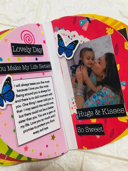 Another page from the semi-circle album, showing how I combine photos and messages to celebrate the special bond between sisters.