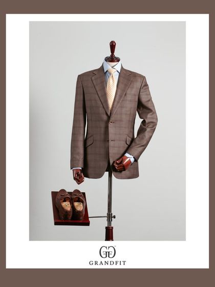 A full view of the brown plaid suit, presented with complementary accessories to inspire a complete and polished look.