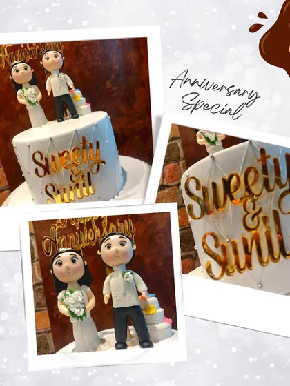 Celebrating an anniversary with a personal touch. This cake features custom fondant figures of the couple, "Sweety & Sunil," making their special day even more memorable with a cake that looks just like them.