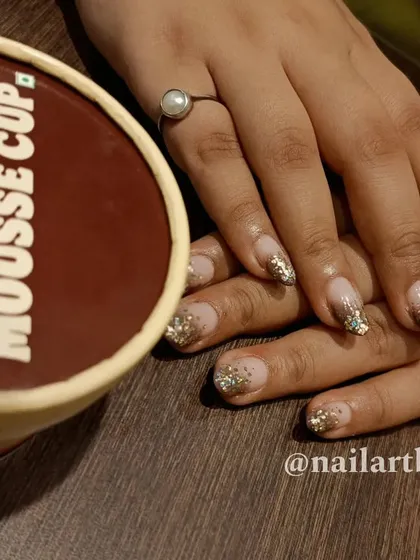 Another variation of a festive glitter nail, perfect for celebrations.