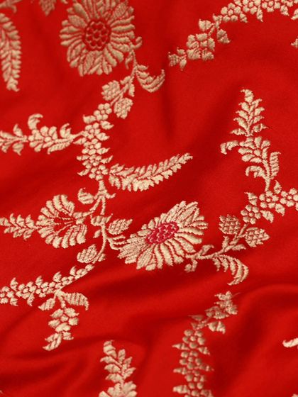 The fine craftsmanship of the Banarasi weave is evident in this detailed shot of the floral jaal pattern.