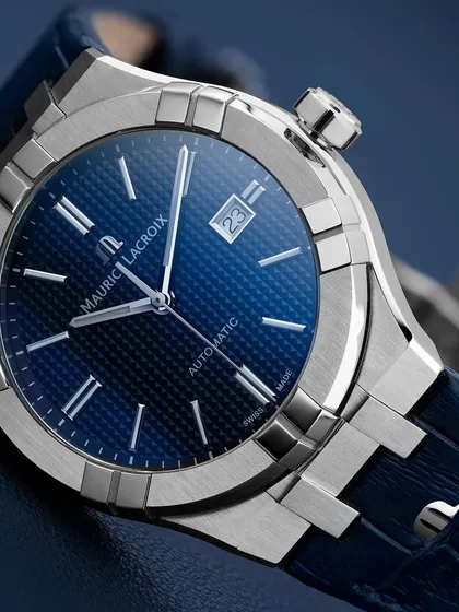 A wider shot of the Maurice Lacroix Aikon, showing how the integrated bracelet and case form a single, seamless design. The focus is on the sharp, architectural lines of the watch.