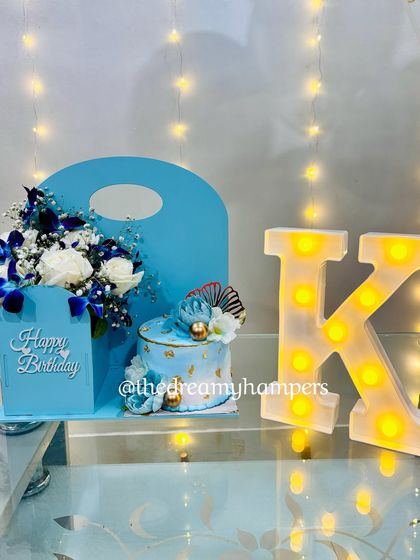 I curated this blue-themed birthday hamper for him, complete with a beautiful cake, fresh flowers, and a marquee letter for a personalized touch. It’s a sophisticated and memorable celebration set.