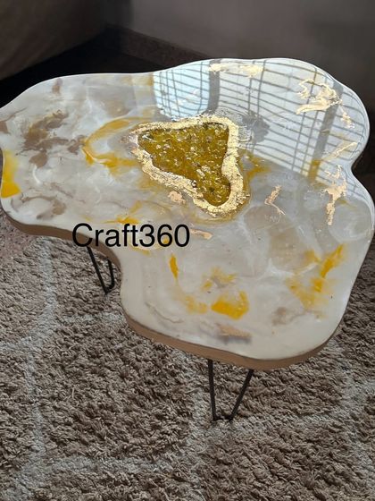 A top-down view of the yellow and white geode coffee table. Each table has a unique, free-flowing shape that makes it truly one-of-a-kind.