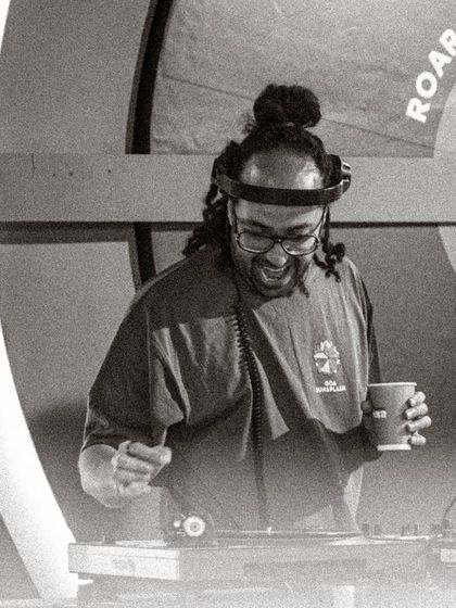 A candid black and white shot of me enjoying the moment during a vinyl set. Even when I'm focused, the joy of playing records always comes through.