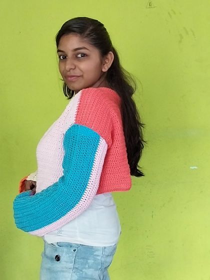 A side view of the multicolored pastel cardigan.