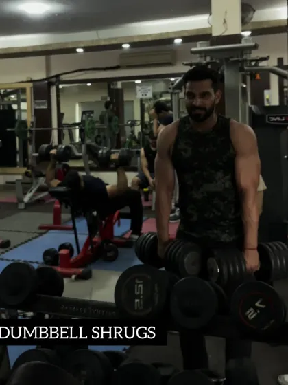 Day 28: Building bigger traps with heavy dumbbell shrugs.