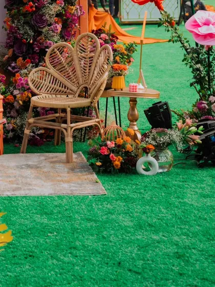 A slightly different angle of the bride's special chair, showing how it creates a perfect photo moment within the whimsical Mehendi setting.