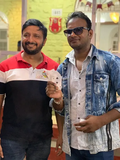 The best magic happens when the audience is part of the trick. Sharing a moment of surprise with a guest after a successful card illusion during a private event for the Collector of Alibag.